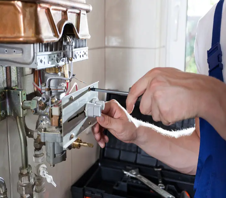 Man carrying out a boiler service in Glasgow