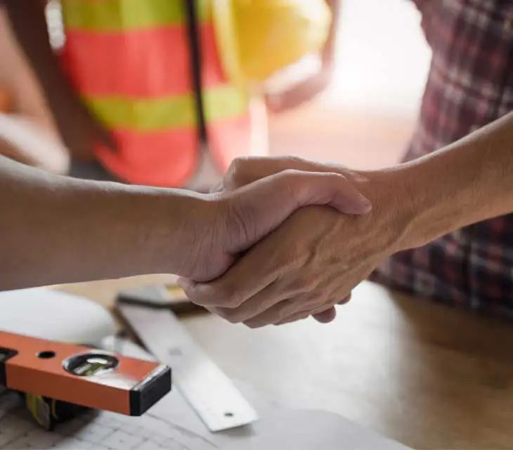 Hand shake demonstrating trust from C Hanlon All Trades Company