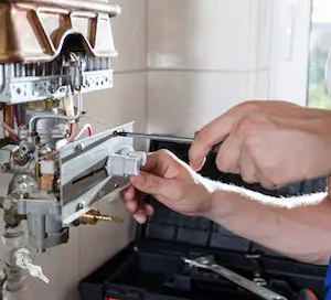 Engineer Servicing Boiler