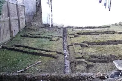 Field drain excavation trench and soakaway pit