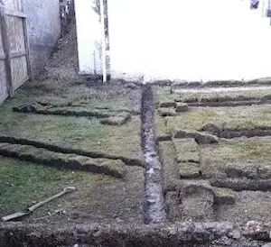 Field drainage excavation trench and soakaway pit